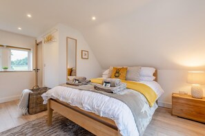 A bedroom with a bed, bedside table, lamp, and a window. - 3 Bed in Litton (oc-e45988) (Litton)