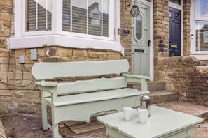 A stone building with a white-painted bench and a table with two white cups and a silver pot. - 3 Bed in Buxton (oc-p45951) (Buxton)