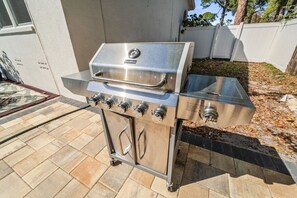 A stainless steel outdoor grill with a control panel, located on a patio with a tiled floor. - Game Room, Pool & Fire Pit Near Madeira Beach (Seminole)