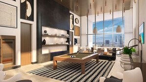 Una sala de estar moderna con mesa de billar, asientos cómodos, un amplio ventanal con vista a la ciudad y una decoración contemporánea.