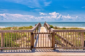 A wooden boardwalk leading to a beach with a clear view of the ocean. - Sugar Magnolia! Beach Front, Private Pool, Free Beach Gear! (St. George Island)