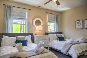 A hotel room with two beds, a ceiling fan, a mirror, a lamp, and artwork on the wall. - Easy Access Mountain Getaway with Panoramic Views (Mars Hill)