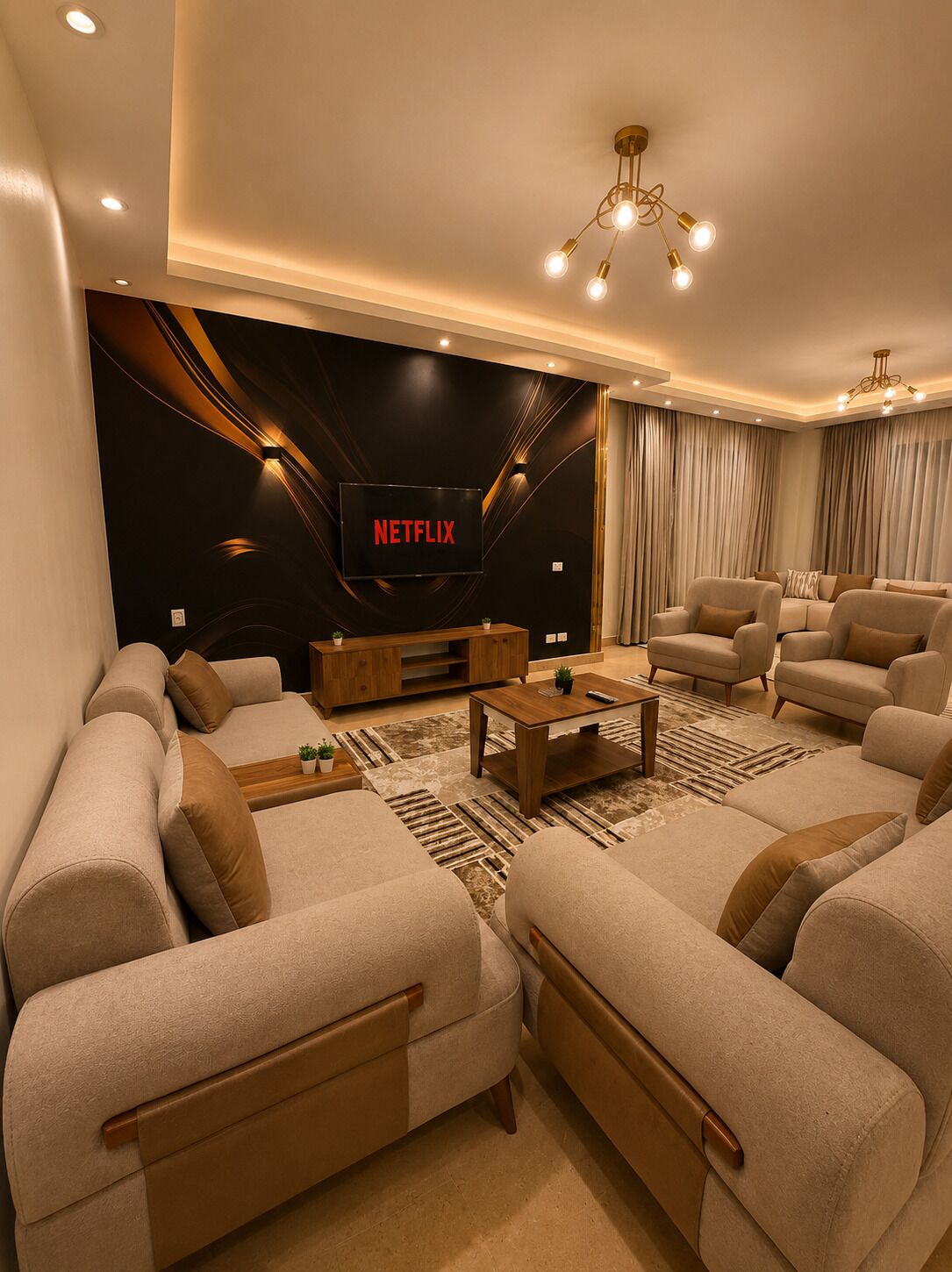 Un salon moderne doté d’un grand téléviseur à écran plat, de canapés confortables, d’une table basse en bois et d’un tapis à motifs.
