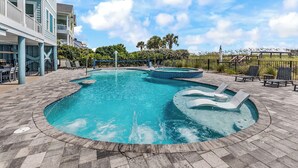 A swimming pool with a hot tub, lounge chairs, and a covered seating area. - Y'all Have Fun - Oceanfront in Garden City Beach (Garden City Beach)