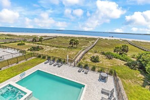 A pool area with a view of the beach and ocean. - Coastal Point of View 10 Bedroom - Oceanfront in Garden City Beach (Garden City Beach)