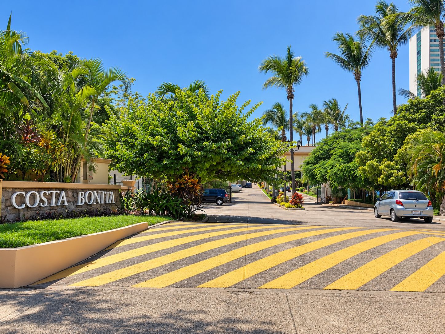 A street view with a sign reading 'COSTA BONITA' and a pedestrian crossing.