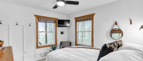 Bedroom 2 features a Queen bed, ample storage space, personal TV, ceiling fan
