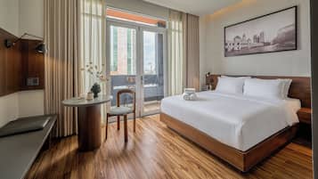 Deluxe Room, City View | In-room safe, desk, laptop workspace, blackout drapes