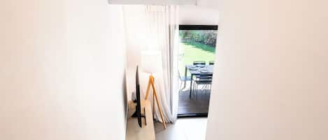 A staircase leading to a dining area with a table set for two.