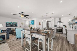 A modern kitchen with a central island, stainless steel appliances, and pendant lighting. - New Listing w/ Limited Time Discounted Rates! Sun, Sand & Your Own Backyard Oasis w/ Private Pool! (Panama City Beach)