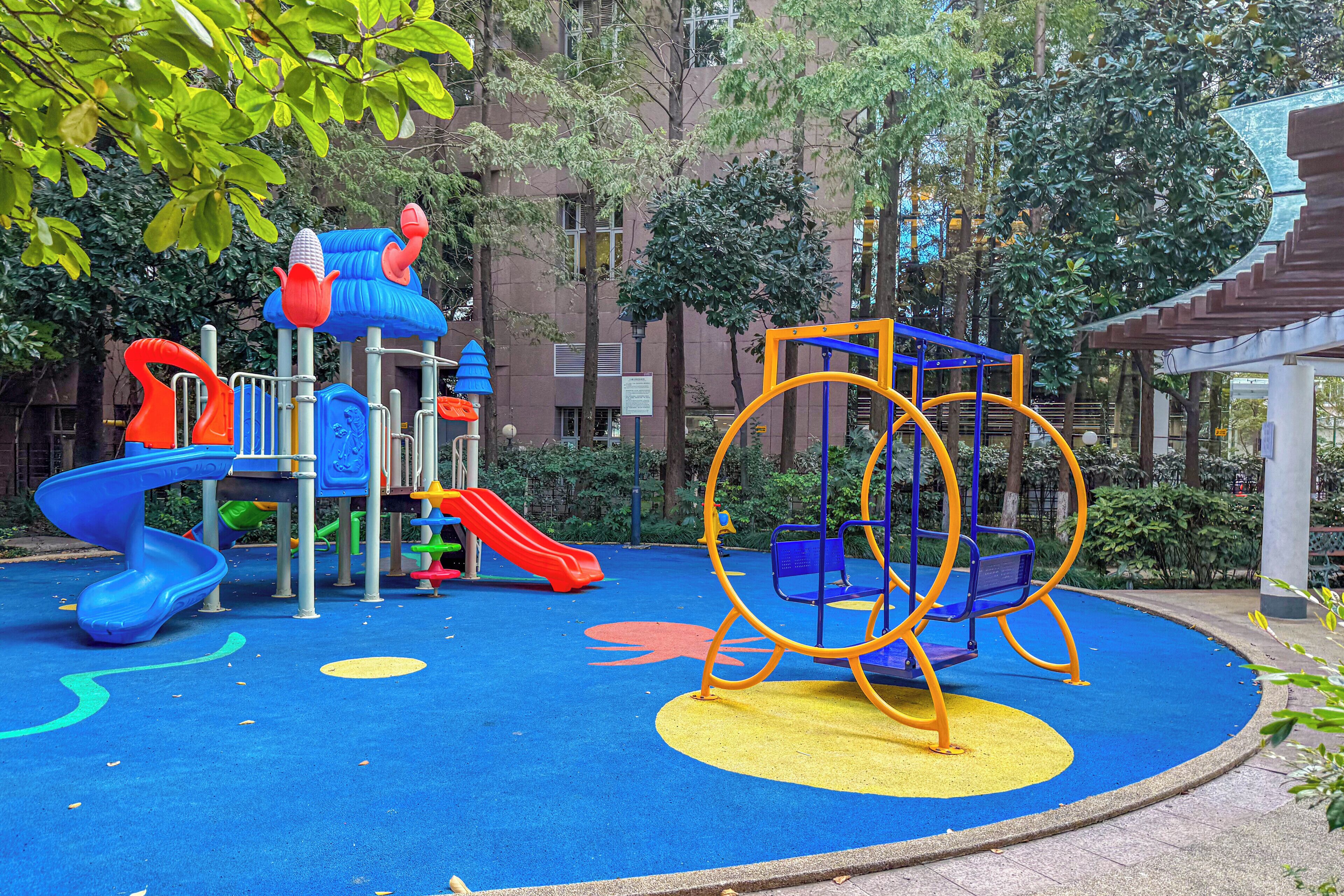 A playground with slides, swings, and climbing structures.