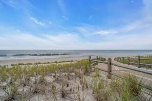 A beach with a wooden boardwalk leading to the shore, sandy dunes, and the ocean. - Normandy Beach! Phenomenal Ocean Block Location (Lavallette)