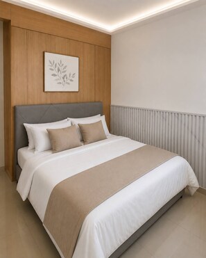 A modern bedroom with a bed, headboard, and a wall-mounted artwork. - Quaint 1BR Condo Terrace-pool view front MOA-Shell (Pasay City)