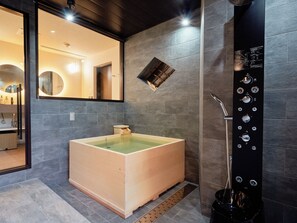 A modern bathroom with a freestanding bathtub, a large mirror, and a wall-mounted control panel. - Imakusa-so, Nara, Naramachi - The Steam Bath House - (奈良市福智院町)