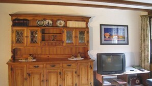 A wooden entertainment center with a television on top. - Casa Laghetto 5 Appartement/Fewo, Bad, WC, 4-Bettwohnung 4-Bettwohnung by Interhome (Arosa)