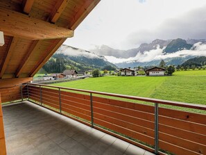A balcony with a view of a green field and mountains. - Kronenplatz 11 OG Appartement/Fewo, Bad, WC, 2 Schlafräume 4 Bettwohnung by Interhome (Lenk)