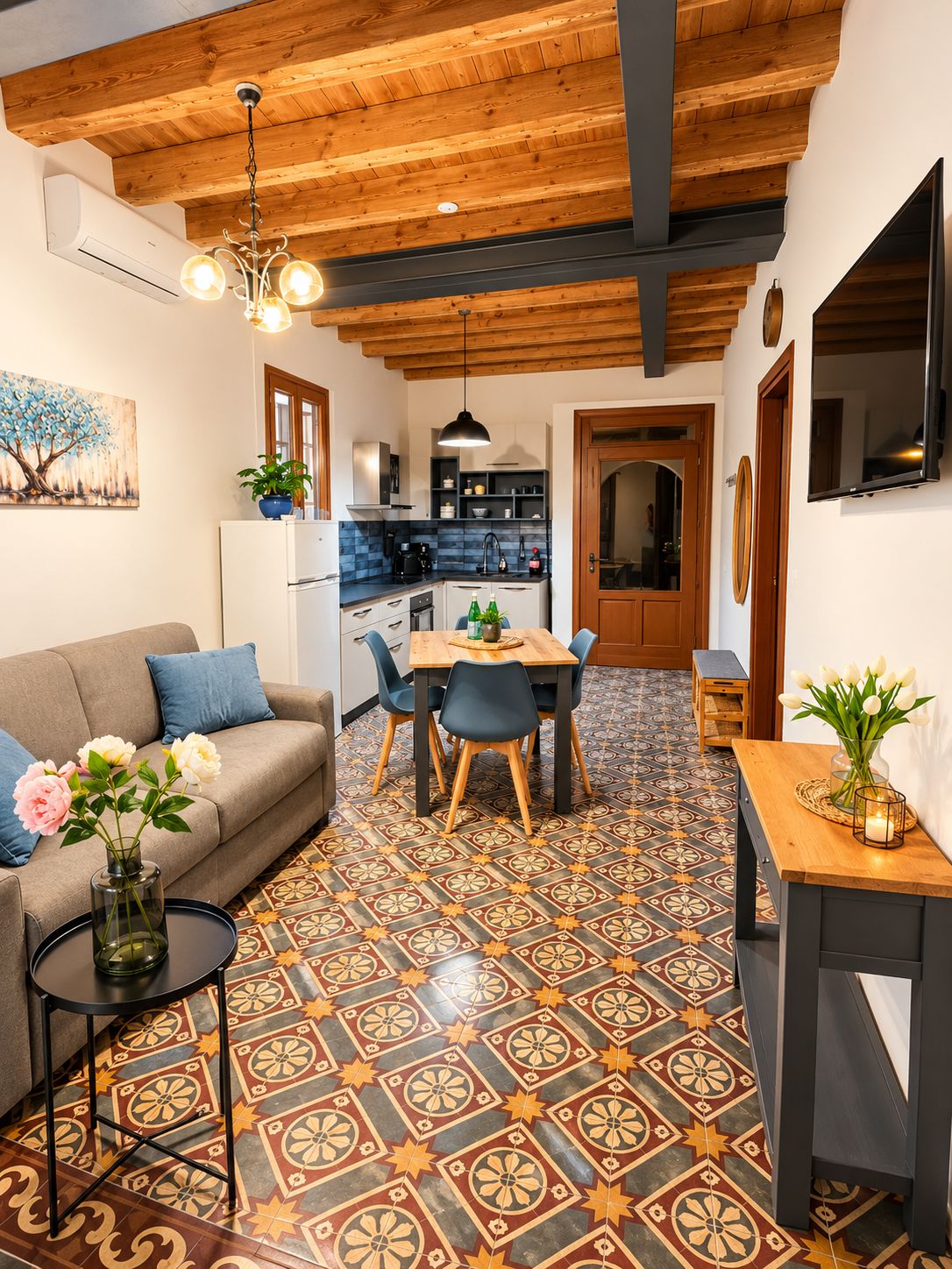 A modern interior with a dining area, kitchen, and living space.