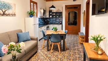 A modern interior with a dining area, kitchen, and living space.