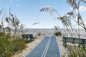 A beach pathway with benches and a sign. - Oceanfront Condo in Palm Coast Surf Club #317 (Palm Coast)