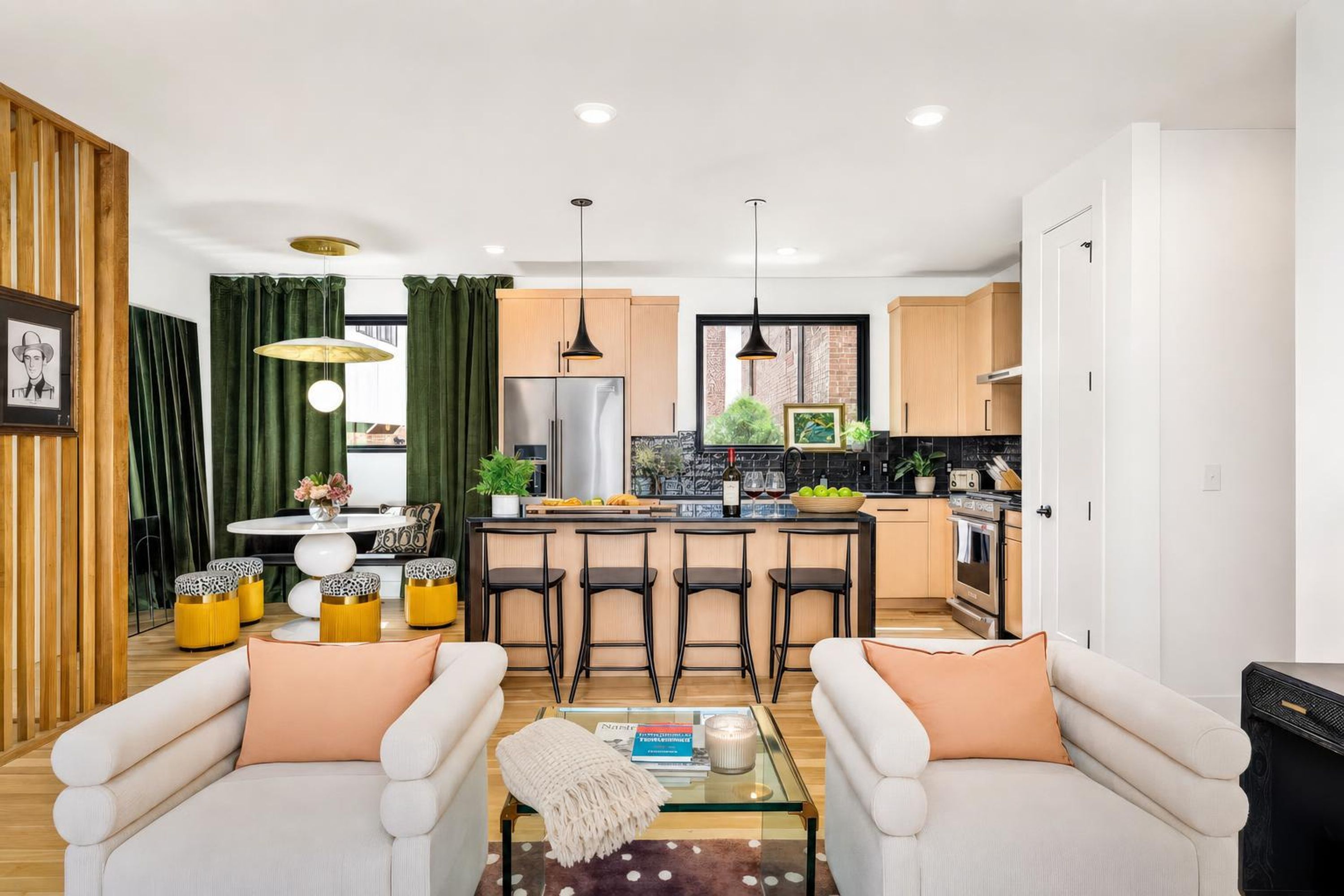 A modern living room with a sofa set, a coffee table, and a dining area with a table and chairs.