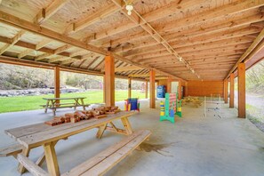 An open wooden pavilion with picnic tables and a climbing wall. - Brand-new Smokies Cabin w/ Spectacular Mtn Views (Sevierville)