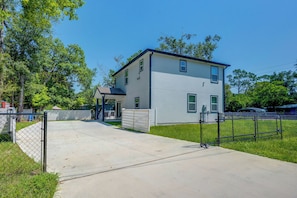 A two-story residential building with a covered patio area. - Family Gem w/ Pool Table! 8 Mi to NAS Jacksonville (Jacksonville)