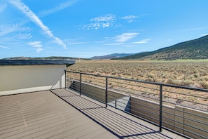 A balcony with a view of a desert landscape and distant hills. - Game Room & Stunning Mtn Views! Cedar City Home (Cedar City)