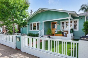 A single-story house with a front porch, a mailbox, and a small garden. - Stroll to Redondo Beach: Modern, Coastal Gem (Redondo Beach)