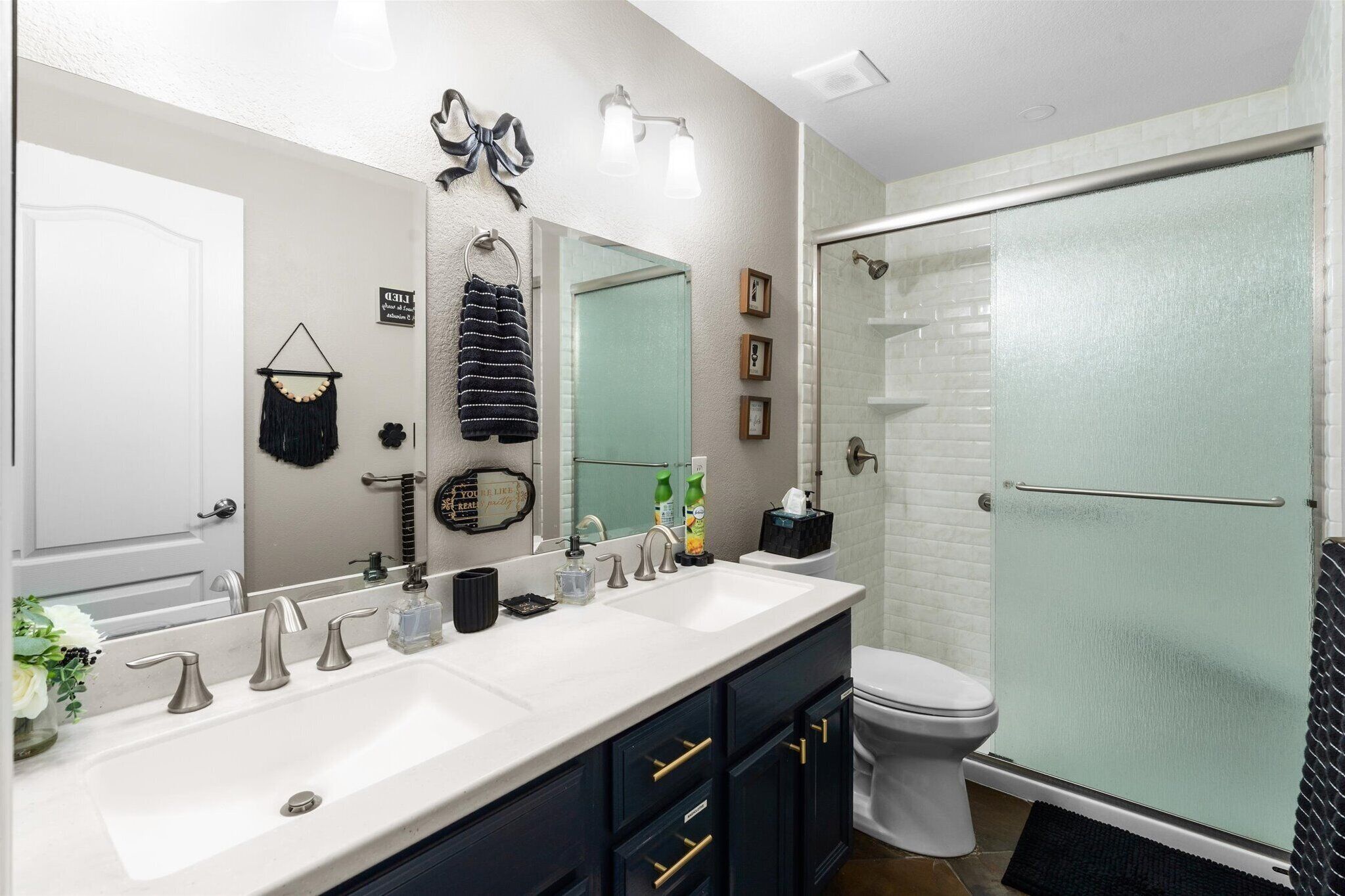 Second full bathroom with dual sinks and a shower/tub combination helps groups get ready with less waiting.