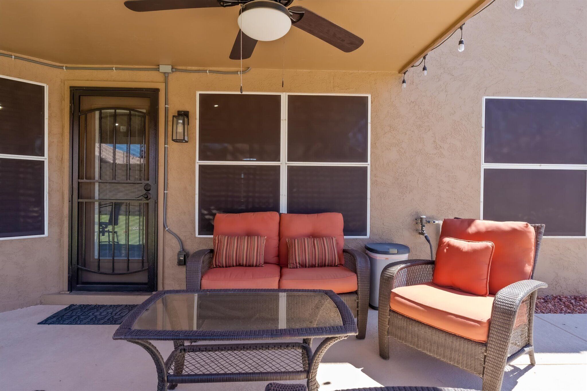 Shaded patio seating provides a comfortable place for morning coffee, conversation, or relaxing poolside.