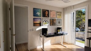 A room with a DJ setup, a door, and a window with a view of the outside. - Palm Springs Family Home – Gym, Garage, Pets, 10 minutes drive from Manly beach (North Balgowlah)