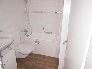 A bathroom with a toilet, sink, and shower. - Studio Selva Appartement/Fewo, Dusche, WC, 1 Schlafraum 1-Zimmerwohnung by Interhome (Adelboden)