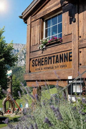 A wooden building with a sign that reads 'SCHERMTANNE' and the year '1903'. - Schermtanne Appartement/Fewo, Dusche oder Bad, WC, 2 Schlafräume Wohnung Nr 1 by Interhome (Adelboden)