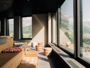 A modern interior with large windows, wooden furniture, and a view of a mountainous landscape. - KURVE Apartments & Lounge Appartement/Fewo, Bad, WC, 1 Schlafraum by Interhome (Adelboden)