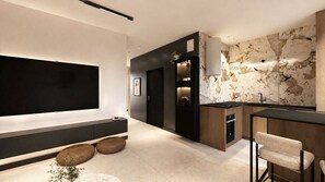 Una cocina moderna con estufa integrada, un comedor con barra y un televisor de pantalla plana grande montado en la pared.