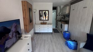 A modern kitchen with a built-in oven, a microwave, and a sink. - PLAGE St CLAIR APARTMENT Le Lavandou Saint Clair, for two on St. Clair Beach (Le Lavandou)