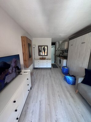 A modern kitchen with a built-in oven, a microwave, and a sink. - PLAGE St CLAIR APARTMENT Le Lavandou Saint Clair, for two on St. Clair Beach (Le Lavandou)