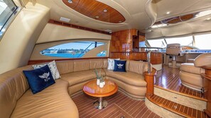 Charter yachts come with plush lounge interiors. Ask us for details. - Sunny Regards Retreat (Fort Lauderdale)