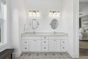 A bathroom with a double vanity, two mirrors, and a light fixture above. - Sun Deck | Communal Pool Access (Inlet Beach)