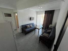 Apartamento luxo, sacada, vista para a montanha | Área de estar