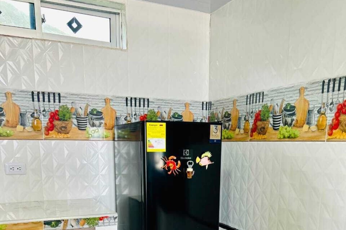 Deluxe Triple Room, Sea View | Private kitchen | Full-sized fridge, microwave, cookware/dishes/utensils, freezer