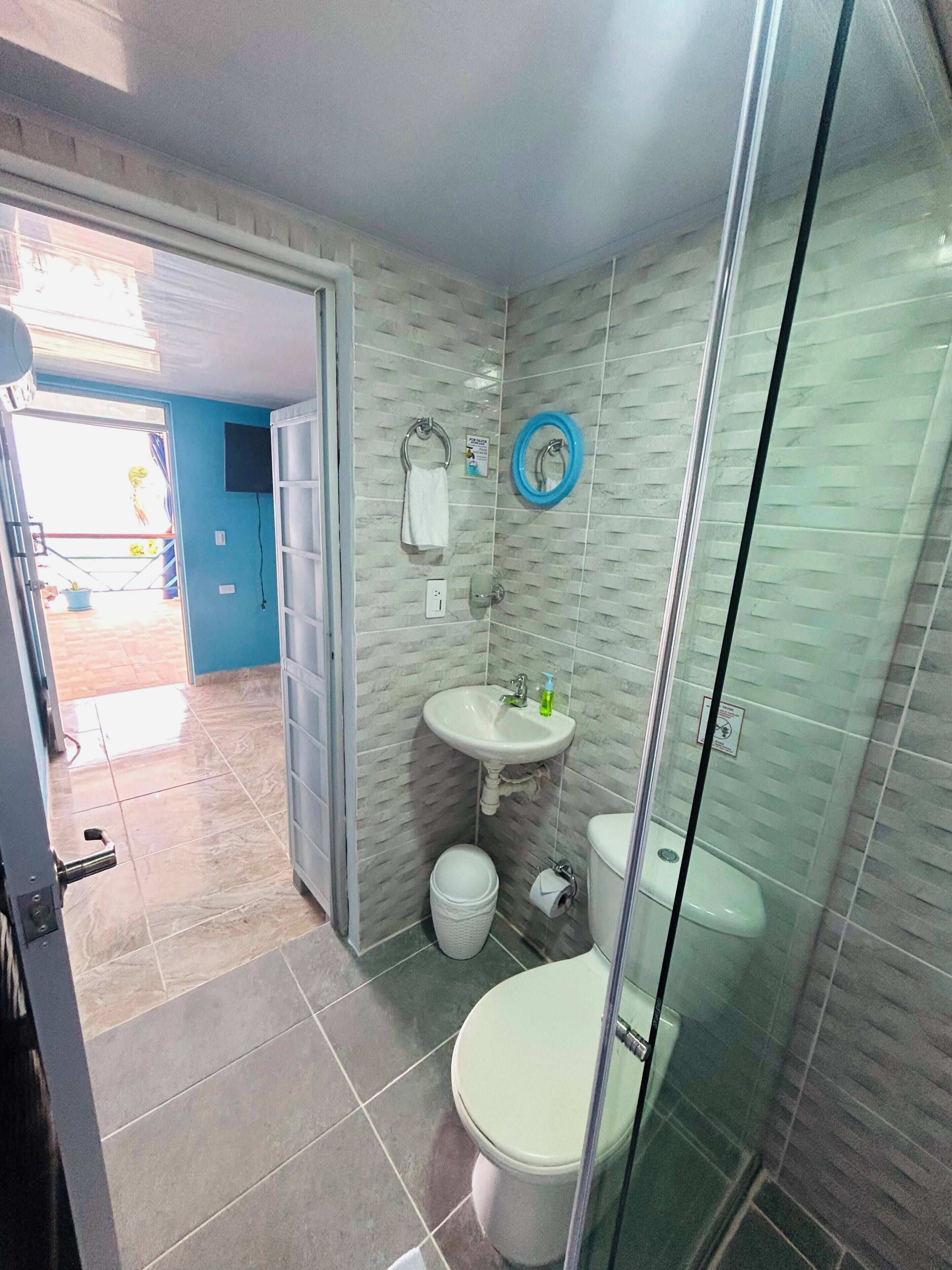 Shower, towels, soap, toilet paper