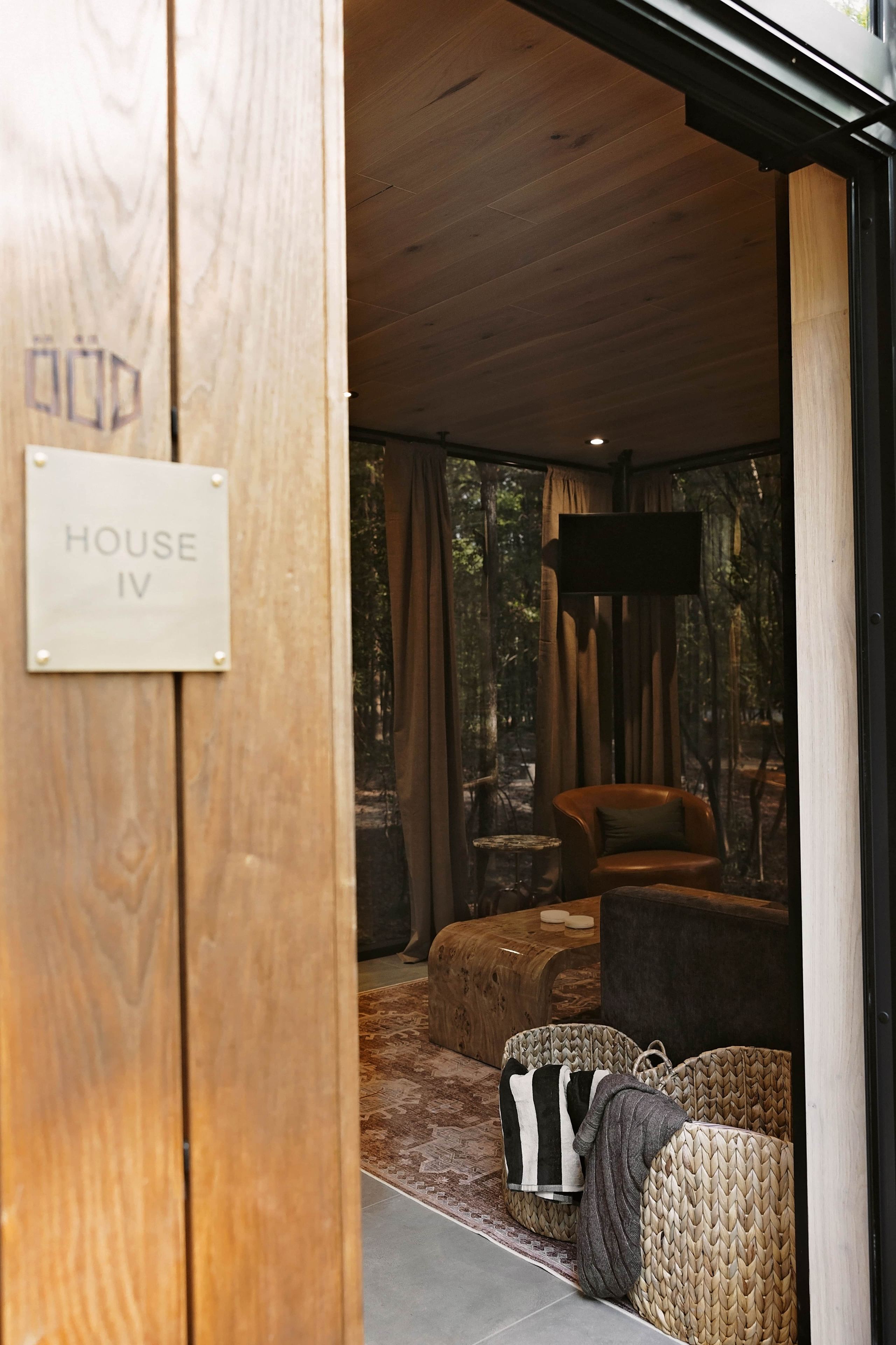 A wooden interior with a sign reading 'HOUSE IV'.