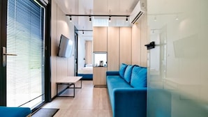 Comfort Quadruple Room, Multiple Beds, Courtyard View | Living area