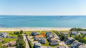 A residential area with houses, a beach, and a view of the ocean. - New Beautiful Estate, Steps to Ocean, Sleeps 12 (Saco)