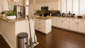 A kitchen with white cabinets, granite countertops, and a central island. - Upscale Desert Oasis - Heated Pool - Golf (Scottsdale)