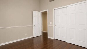 A hallway with wooden flooring and white doors. - Upscale Desert Oasis - Heated Pool - Golf (Scottsdale)