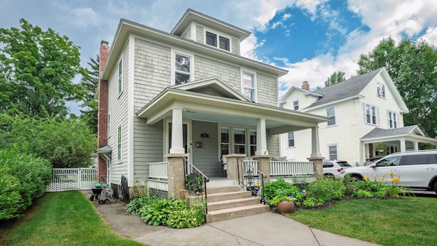 A two-story house with a front porch, a driveway, and a lawn. - NEW! Prelaunch Pricing Close to Track and Downtown (Saratoga Springs)