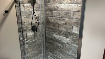 Shower, towels, soap, toilet paper