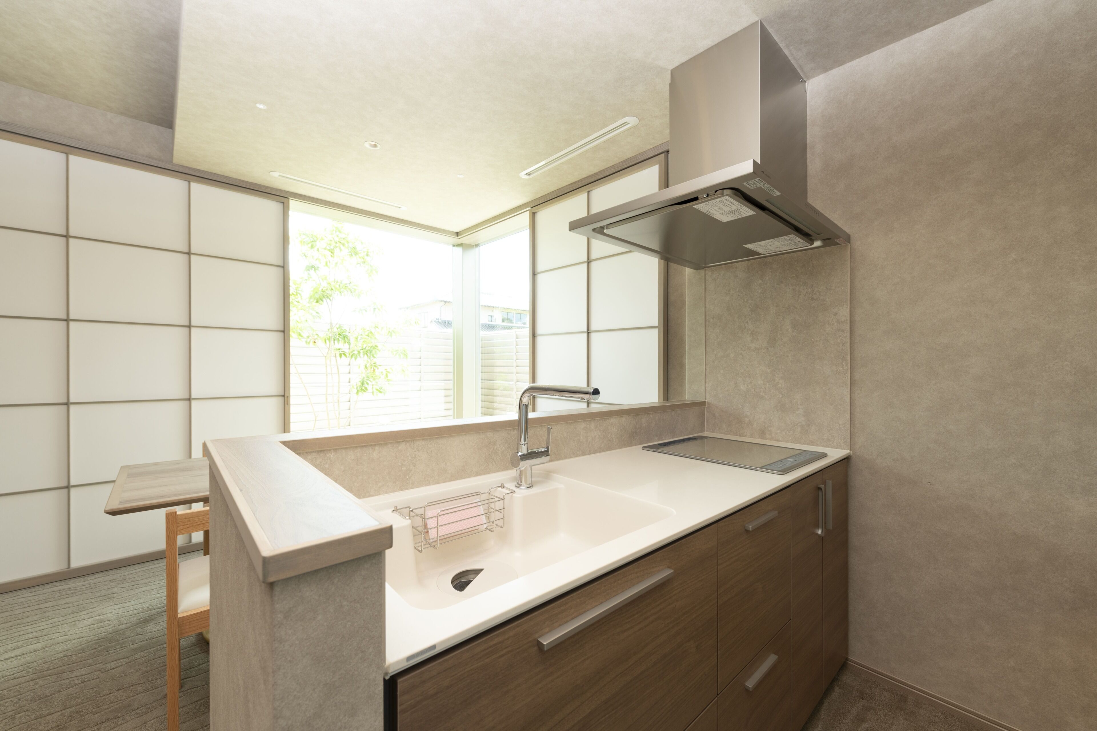 A modern bathroom with a sink, mirror, and cabinet.